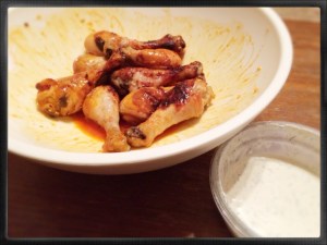 Superbowl Sunday baked drumsticks with a mango glaze and tossed in Ghee and Franks Red Hot Sauce. YUMMO!